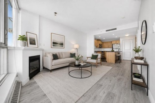 904-55 Spruce Place Sw, Calgary, AB - Indoor Photo Showing Living Room With Fireplace