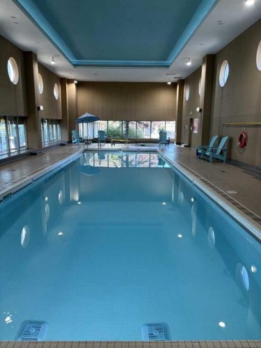 904-55 Spruce Place Sw, Calgary, AB - Indoor Photo Showing Other Room With In Ground Pool