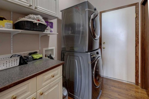 321 Gleneagles View, Cochrane, AB - Indoor Photo Showing Laundry Room