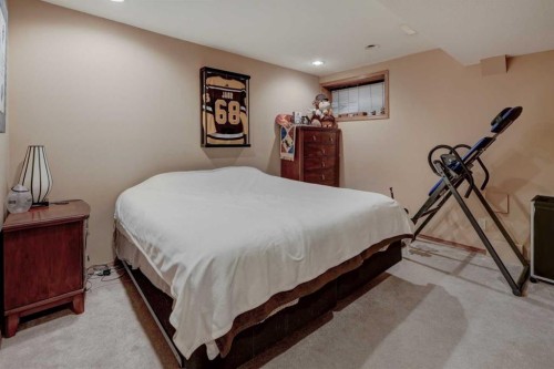 321 Gleneagles View, Cochrane, AB - Indoor Photo Showing Bedroom