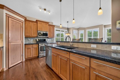 66 Evercreek Bluffs View Sw, Calgary, AB - Indoor Photo Showing Kitchen With Double Sink