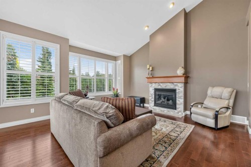 66 Evercreek Bluffs View Sw, Calgary, AB - Indoor Photo Showing Living Room With Fireplace