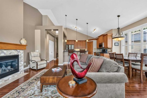 66 Evercreek Bluffs View Sw, Calgary, AB - Indoor Photo Showing Living Room With Fireplace