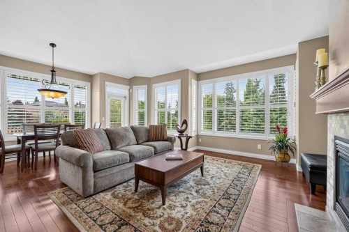 66 Evercreek Bluffs View Sw, Calgary, AB - Indoor Photo Showing Living Room With Fireplace