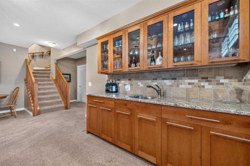 66 Evercreek Bluffs View Sw, Calgary, AB - Indoor Photo Showing Kitchen With Double Sink