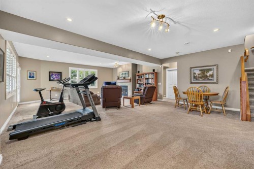 66 Evercreek Bluffs View Sw, Calgary, AB - Indoor Photo Showing Gym Room