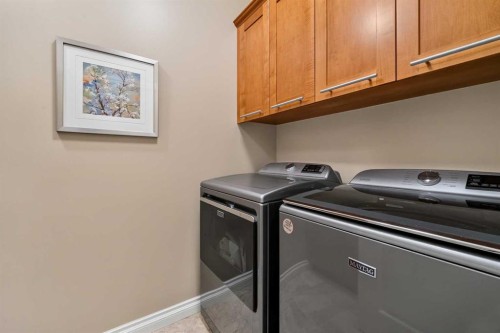 66 Evercreek Bluffs View Sw, Calgary, AB - Indoor Photo Showing Laundry Room