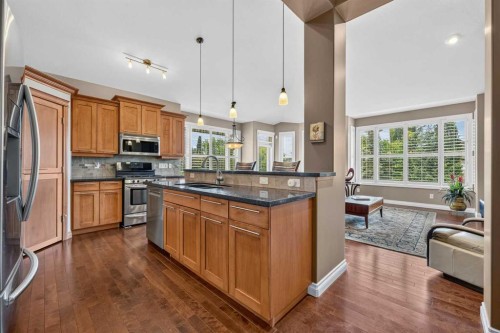 66 Evercreek Bluffs View Sw, Calgary, AB - Indoor Photo Showing Kitchen With Double Sink