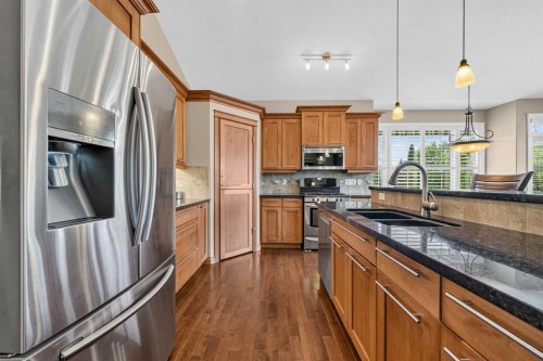 66 Evercreek Bluffs View Sw, Calgary, AB - Indoor Photo Showing Kitchen With Double Sink With Upgraded Kitchen