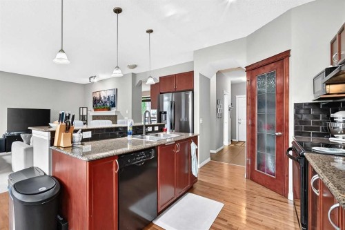 121 Chapalina Heights Se, Calgary, AB - Indoor Photo Showing Kitchen With Double Sink With Upgraded Kitchen