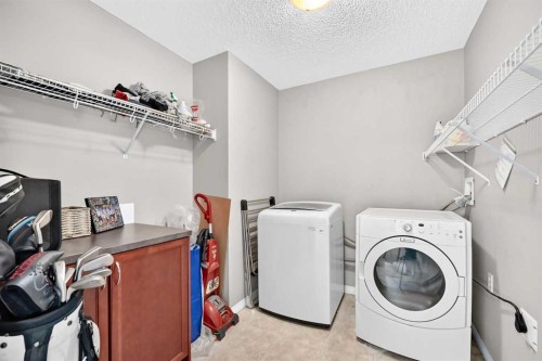 121 Chapalina Heights Se, Calgary, AB - Indoor Photo Showing Laundry Room