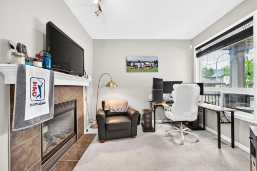 121 Chapalina Heights Se, Calgary, AB - Indoor With Fireplace