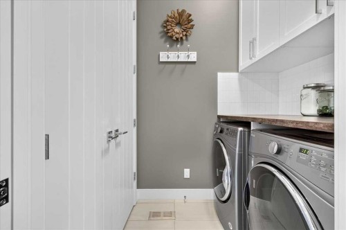 24 Mahogany Gardens Se, Calgary, AB - Indoor Photo Showing Laundry Room