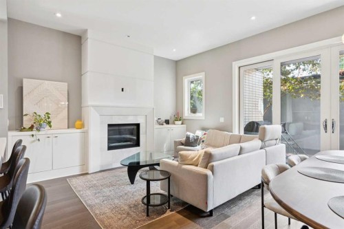 2-1713 36 Avenue Sw, Calgary, AB - Indoor Photo Showing Living Room With Fireplace
