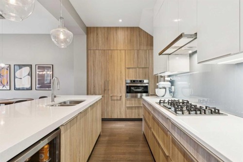 2-1713 36 Avenue Sw, Calgary, AB - Indoor Photo Showing Kitchen With Double Sink With Upgraded Kitchen