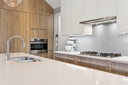 2-1713 36 Avenue Sw, Calgary, AB - Indoor Photo Showing Kitchen With Double Sink With Upgraded Kitchen