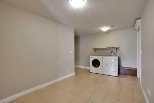 126 Panatella Crescent Nw, Calgary, AB - Indoor Photo Showing Laundry Room