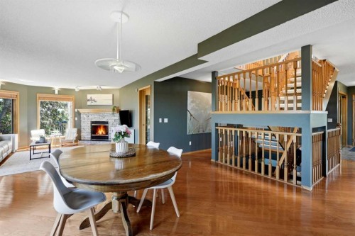 131 Edgebrook Circle Nw, Calgary, AB - Indoor Photo Showing Dining Room With Fireplace