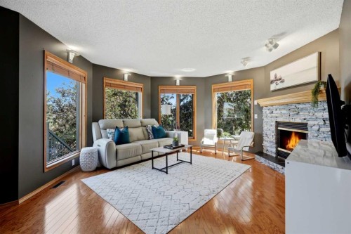 131 Edgebrook Circle Nw, Calgary, AB - Indoor Photo Showing Living Room With Fireplace