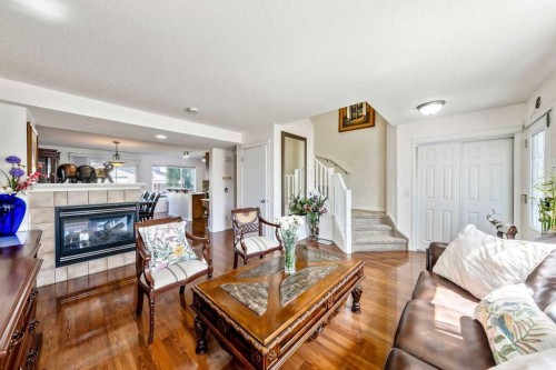 455 Prestwick Circle Se, Calgary, AB - Indoor Photo Showing Living Room With Fireplace