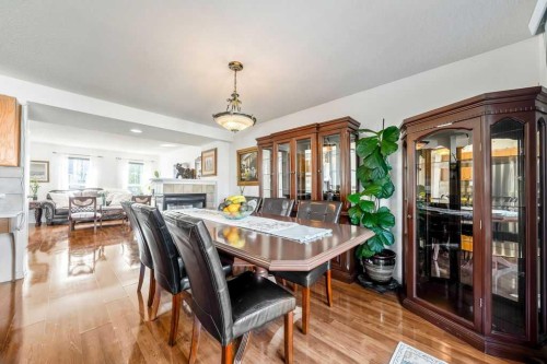 455 Prestwick Circle Se, Calgary, AB - Indoor Photo Showing Dining Room With Fireplace