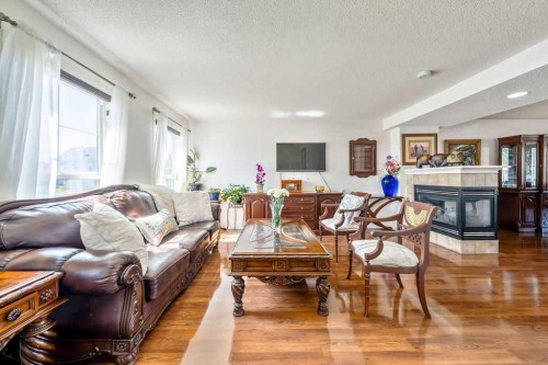 455 Prestwick Circle Se, Calgary, AB - Indoor Photo Showing Living Room With Fireplace