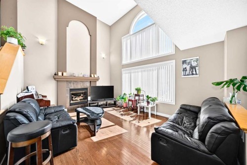505 Kincora Bay Nw, Calgary, AB - Indoor Photo Showing Living Room With Fireplace