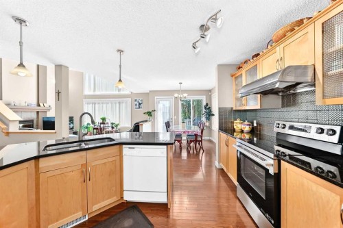 505 Kincora Bay Nw, Calgary, AB - Indoor Photo Showing Kitchen With Stainless Steel Kitchen With Double Sink With Upgraded Kitchen