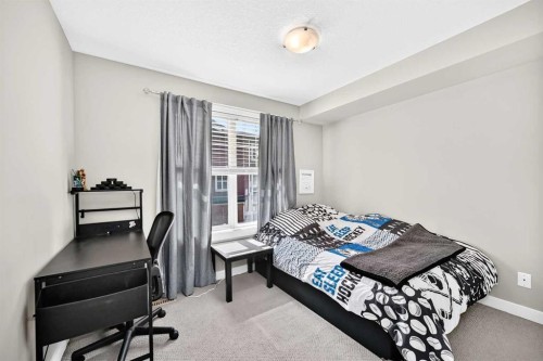 154 Cranford Walk Se, Calgary, AB - Indoor Photo Showing Bedroom