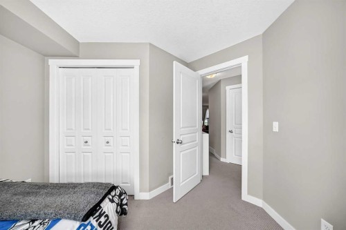 154 Cranford Walk Se, Calgary, AB - Indoor Photo Showing Bedroom
