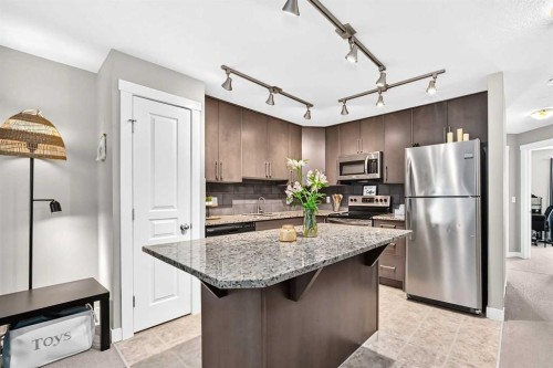 154 Cranford Walk Se, Calgary, AB - Indoor Photo Showing Kitchen With Upgraded Kitchen