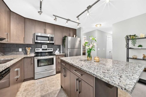 154 Cranford Walk Se, Calgary, AB - Indoor Photo Showing Kitchen With Upgraded Kitchen