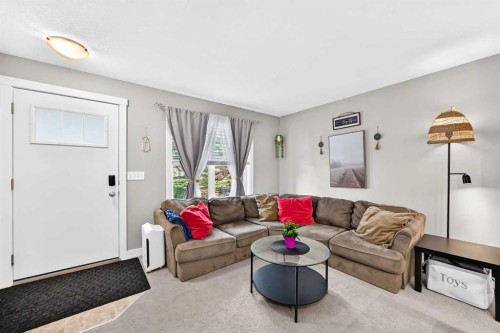 154 Cranford Walk Se, Calgary, AB - Indoor Photo Showing Living Room