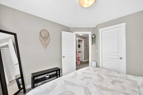 154 Cranford Walk Se, Calgary, AB - Indoor Photo Showing Bedroom
