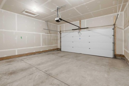 199 Carringham Road Nw, Calgary, AB - Indoor Photo Showing Garage