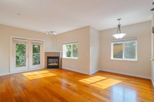 202-509 21 Avenue Sw, Calgary, AB - Indoor Photo Showing Living Room With Fireplace