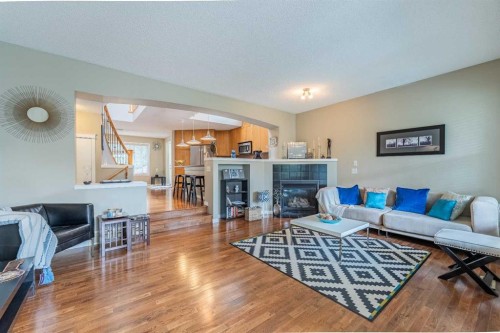 57 Auburn Bay View Se, Calgary, AB - Indoor Photo Showing Living Room With Fireplace