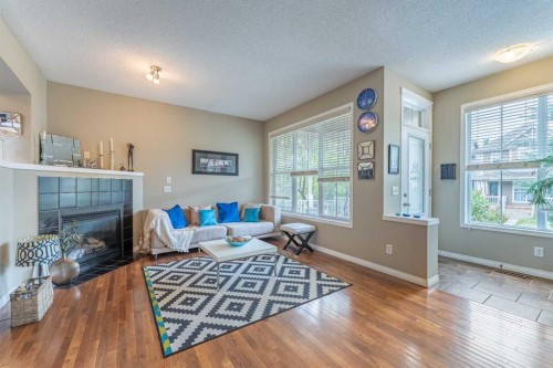 57 Auburn Bay View Se, Calgary, AB - Indoor Photo Showing Other Room With Fireplace