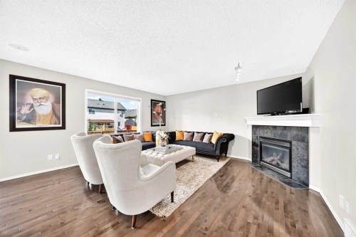 150 Springmere Drive, Chestermere, AB - Indoor Photo Showing Living Room With Fireplace