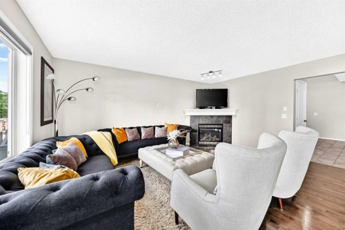 150 Springmere Drive, Chestermere, AB - Indoor Photo Showing Living Room With Fireplace