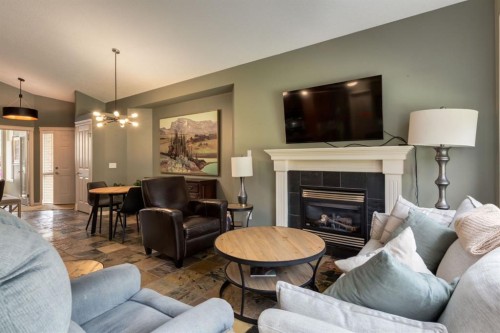 218 Springbank Villas Sw, Calgary, AB - Indoor Photo Showing Living Room With Fireplace