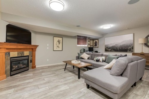 218 Springbank Villas Sw, Calgary, AB - Indoor Photo Showing Living Room With Fireplace