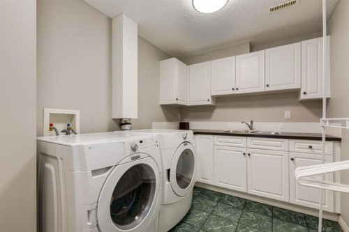 218 Springbank Villas Sw, Calgary, AB - Indoor Photo Showing Laundry Room