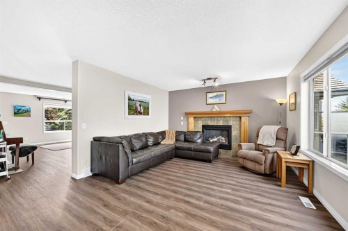 60 Harvest Park Way, Calgary, AB - Indoor Photo Showing Living Room With Fireplace