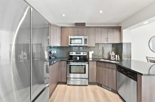 14 Windford Crescent Sw, Airdrie, AB - Indoor Photo Showing Kitchen With Stainless Steel Kitchen With Upgraded Kitchen