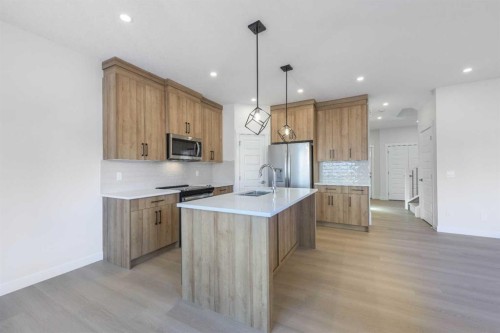 126 Sandpiper Bend, Chestermere, AB - Indoor Photo Showing Kitchen With Stainless Steel Kitchen With Upgraded Kitchen