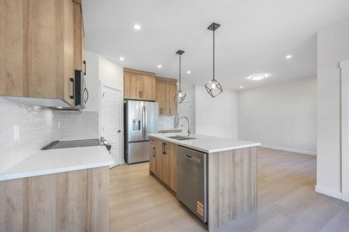 126 Sandpiper Bend, Chestermere, AB - Indoor Photo Showing Kitchen With Stainless Steel Kitchen With Upgraded Kitchen