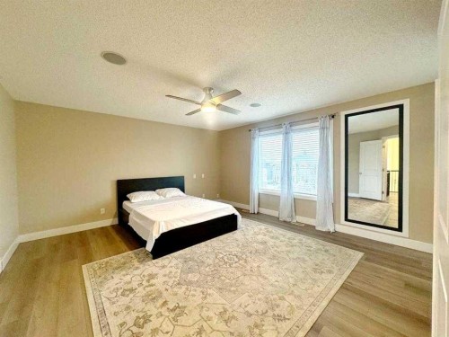 109 Kinniburgh Boulevard E Boulevard East, Chestermere, AB - Indoor Photo Showing Bedroom