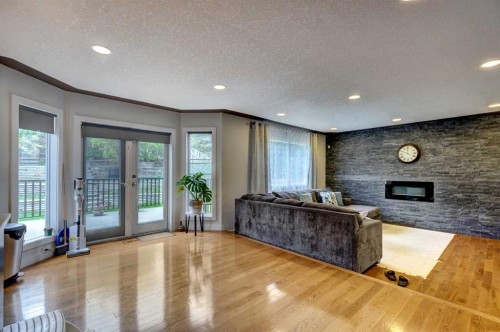 85 Sidon Crescent Sw, Calgary, AB - Indoor With Fireplace