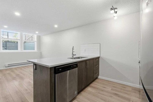 124 Cranbrook Square Se, Calgary, AB - Indoor Photo Showing Kitchen With Double Sink